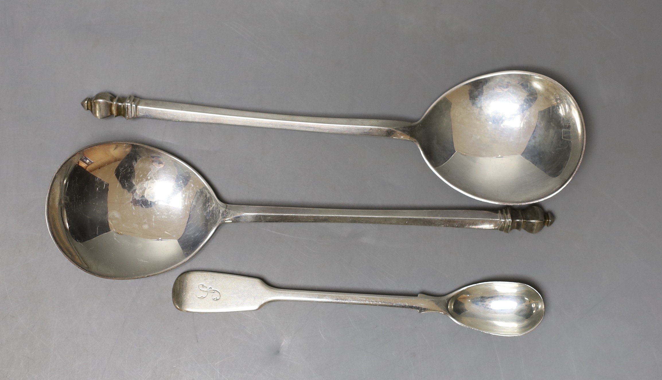 A pair of George V silver serving? spoons, Mappin & Webb, Birmingham, 1930, 19.1cm and an earlier silver condiment spoon, 152 grams.